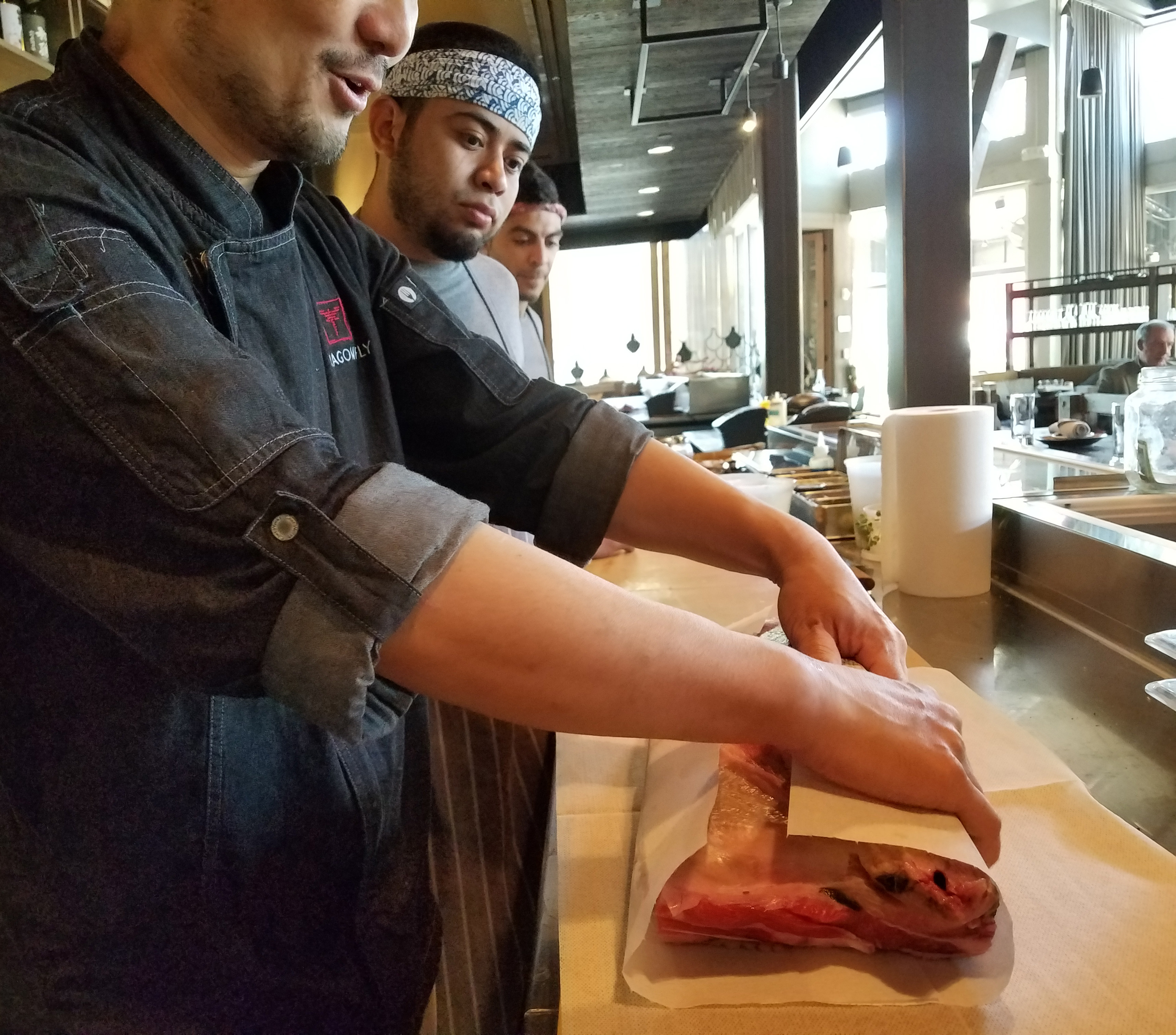 Chef Masa teaching the team his 21-day aged o-toro process.